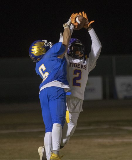 Lemoore's Chris Taylor comes up with an interception during Friday night's Division 3 playoff game at Bakersfield Christian.